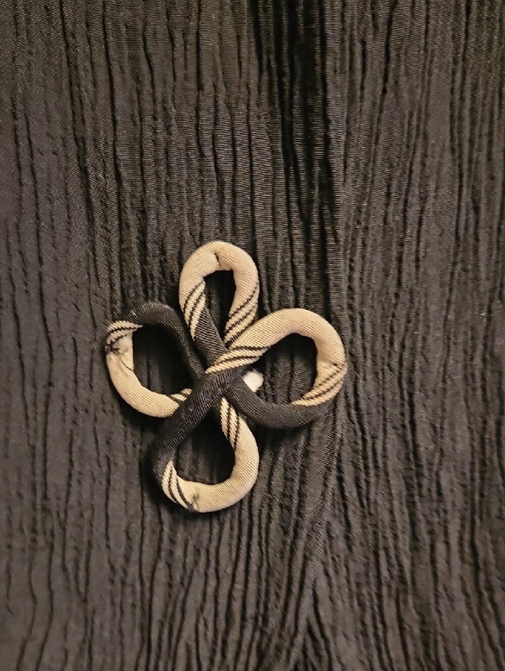 Black Crinkle Sleeveless V-Neck Vest with Decorative Large Unique Swirl Buttons - Picture 4 of 6
